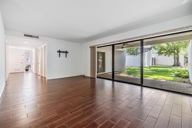4002 Cypress Ct Unit 4002, Tampa, FL 33618 - unfurnished room featuring baseboards, visible vents, and dark wood-style floors
