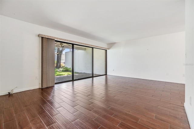 4002 Cypress Ct Unit 4002, Tampa, FL 33618 - spare room with baseboards and wood finished floors