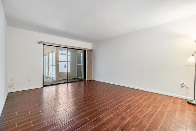 4002 Cypress Ct Unit 4002, Tampa, FL 33618 - empty room featuring baseboards and dark wood-type flooring