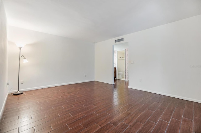 4002 Cypress Ct Unit 4002, Tampa, FL 33618 - spare room featuring baseboards, visible vents, and dark wood-style floors
