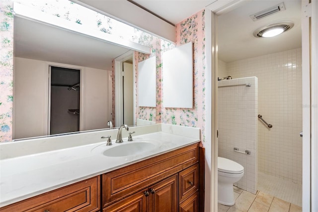 4002 Cypress Ct Unit 4002, Tampa, FL 33618 - bathroom featuring wallpapered walls, vanity, toilet, and tiled shower