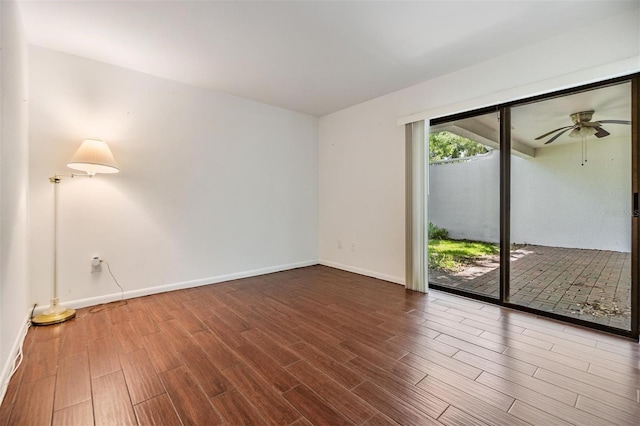 4002 Cypress Ct Unit 4002, Tampa, FL 33618 - unfurnished room featuring baseboards, a ceiling fan, and wood finished floors
