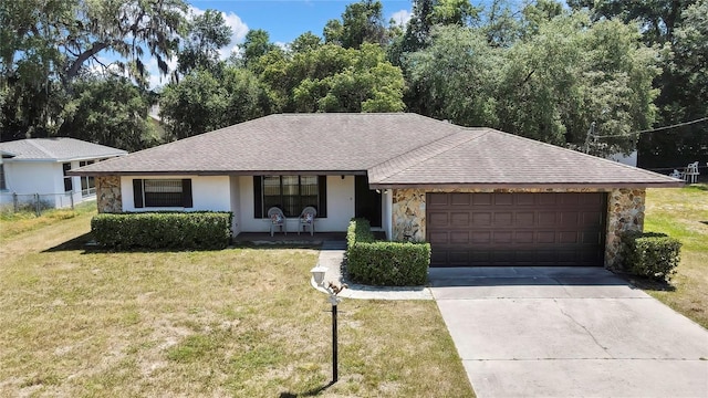 883 N Hollywood Cir, Crystal River, FL 34429 - ranch-style house featuring a front yard, driveway, an attached garage, and stone siding