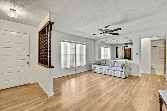 883 N Hollywood Cir, Crystal River, FL 34429 - entryway with a ceiling fan, light wood finished floors, and a textured ceiling