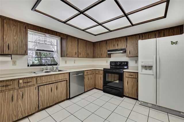 883 N Hollywood Cir, Crystal River, FL 34429 - kitchen with stainless steel dishwasher, white refrigerator with ice dispenser, a sink, under cabinet range hood, and black range with electric cooktop