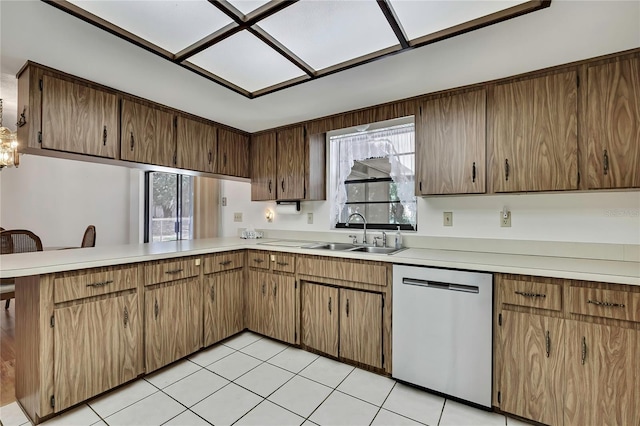 883 N Hollywood Cir, Crystal River, FL 34429 - kitchen with stainless steel dishwasher, a peninsula, a sink, and light countertops