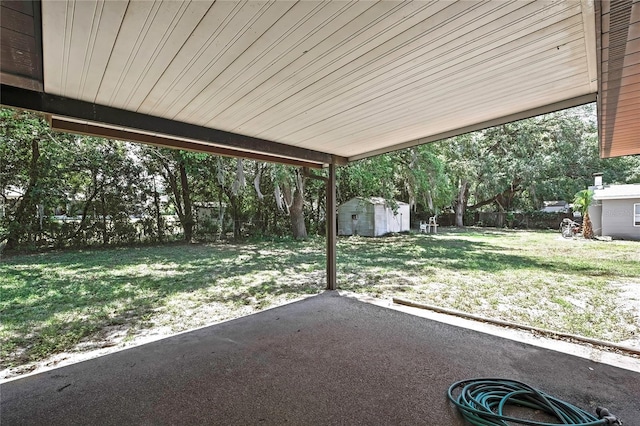 883 N Hollywood Cir, Crystal River, FL 34429 - view of yard with a patio, an outbuilding, and a storage unit
