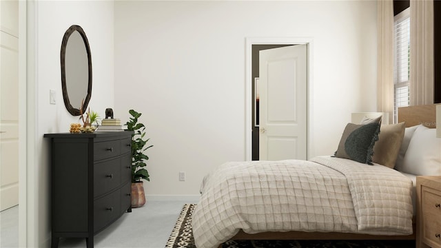 bedroom with baseboards and light carpet