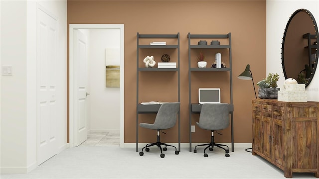 carpeted office space featuring baseboards