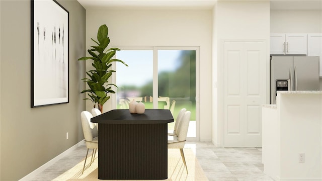 dining space featuring baseboards