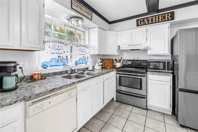 kitchen with a sink, stainless steel appliances, white cabinetry, light tile patterned floors, and under cabinet range hood