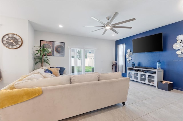 living area with recessed lighting, ceiling fan, and light tile patterned floors