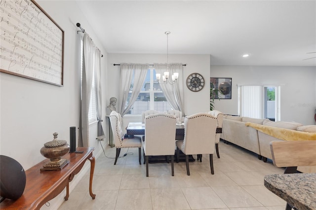 dining area featuring light tile patterned flooring, a notable chandelier, and recessed lighting