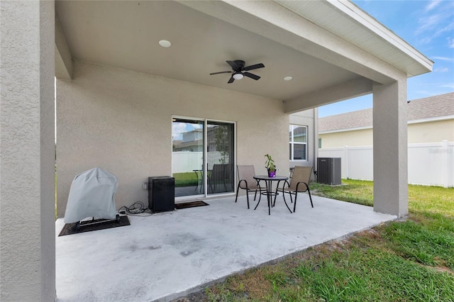 view of patio featuring fence, a ceiling fan, and central AC unit