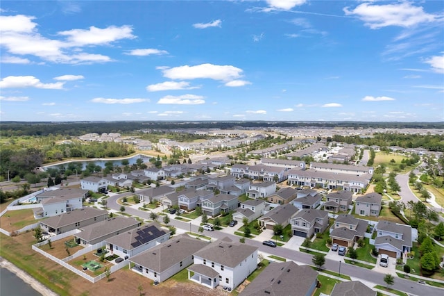 aerial view featuring a water view and a residential view
