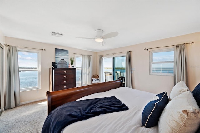 bedroom featuring ceiling fan, access to exterior, carpet, baseboards, and visible vents