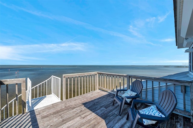 wooden terrace with a water view