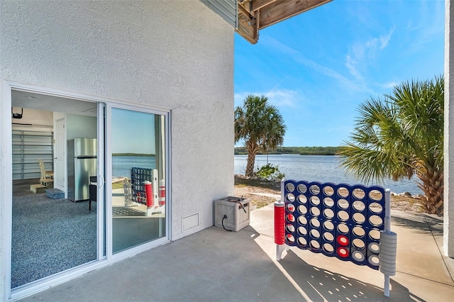 view of patio / terrace featuring a water view