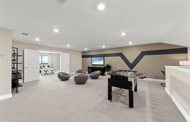 recreation room featuring recessed lighting, baseboards, visible vents, and carpet