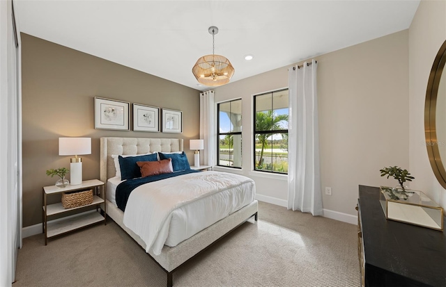 bedroom featuring recessed lighting, baseboards, an inviting chandelier, and light carpet