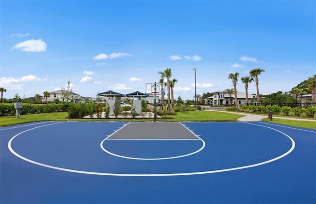 view of sport court featuring community basketball court and a yard