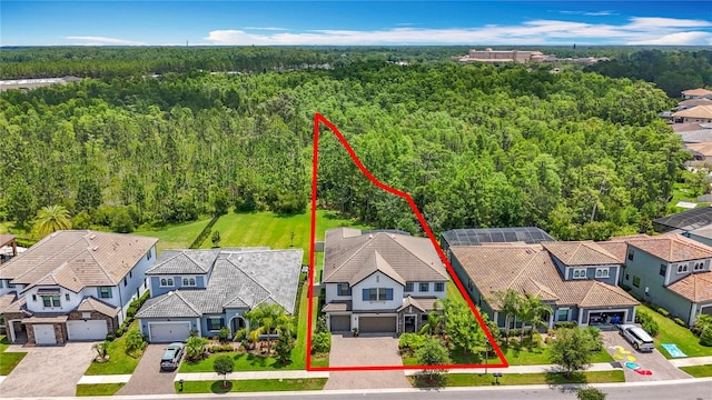 18203 Pine Hammock Blvd, Lutz, FL 33548 - aerial perspective of suburban area featuring a forest and property parcel outlined
