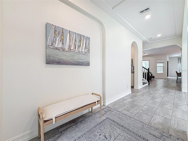 18203 Pine Hammock Blvd, Lutz, FL 33548 - hallway with arched walkways, baseboards, stairs, and recessed lighting