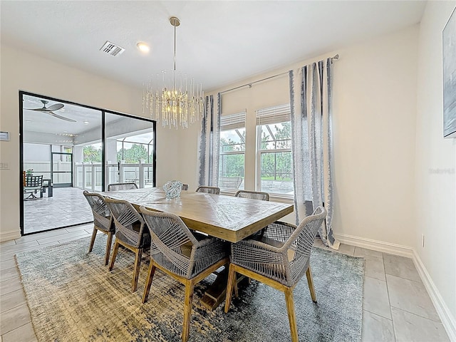18203 Pine Hammock Blvd, Lutz, FL 33548 - dining room featuring a chandelier, light tile patterned floors, and baseboards