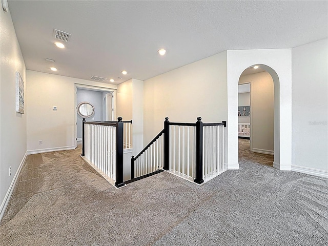18203 Pine Hammock Blvd, Lutz, FL 33548 - corridor with an upstairs landing, carpet, arched walkways, baseboards, and recessed lighting