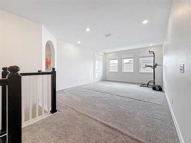 18203 Pine Hammock Blvd, Lutz, FL 33548 - carpeted spare room with baseboards, recessed lighting, and arched walkways