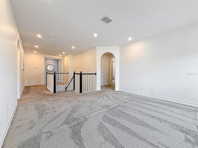 18203 Pine Hammock Blvd, Lutz, FL 33548 - unfurnished room featuring arched walkways, light colored carpet, recessed lighting, and baseboards