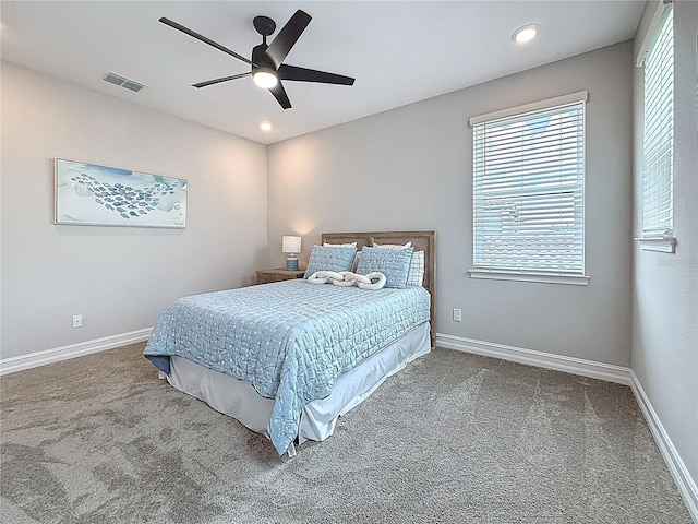 18203 Pine Hammock Blvd, Lutz, FL 33548 - carpeted bedroom featuring multiple windows, baseboards, recessed lighting, and ceiling fan