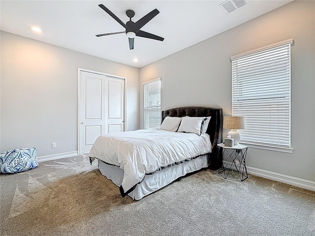 18203 Pine Hammock Blvd, Lutz, FL 33548 - carpeted bedroom featuring baseboards, a closet, a ceiling fan, multiple windows, and recessed lighting