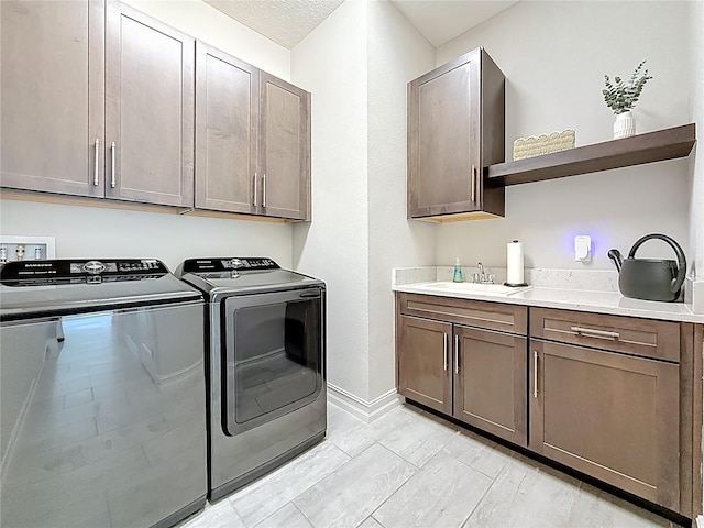 18203 Pine Hammock Blvd, Lutz, FL 33548 - washroom featuring independent washer and dryer, cabinet space, and baseboards