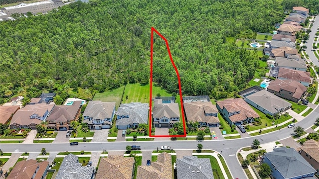 18203 Pine Hammock Blvd, Lutz, FL 33548 - aerial perspective of suburban area with property parcel outlined and a forest