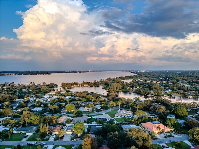 bird's eye view featuring a water view and a residential view
