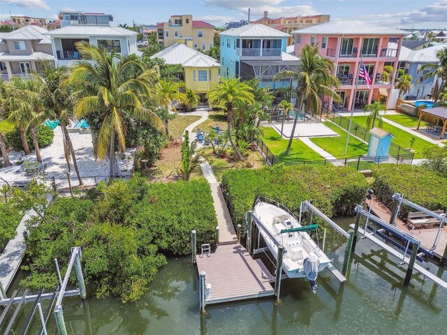 1326 Apollo Beach Blvd S, Apollo Beach, FL 33572 - view of dock with a fenced backyard, a residential view, boat lift, and a water view