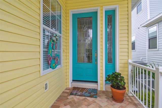 1326 Apollo Beach Blvd S, Apollo Beach, FL 33572 - property entrance featuring a porch and visible vents