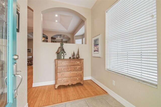 1326 Apollo Beach Blvd S, Apollo Beach, FL 33572 - foyer entrance with baseboards, arched walkways, wood finished floors, and recessed lighting