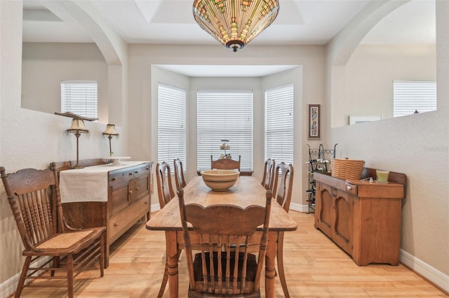 1326 Apollo Beach Blvd S, Apollo Beach, FL 33572 - dining room with light wood-style floors, arched walkways, and a wealth of natural light