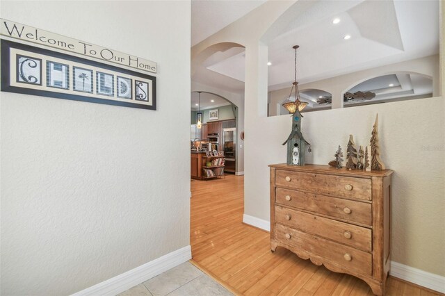 1326 Apollo Beach Blvd S, Apollo Beach, FL 33572 - hall with arched walkways, baseboards, recessed lighting, and wood finished floors