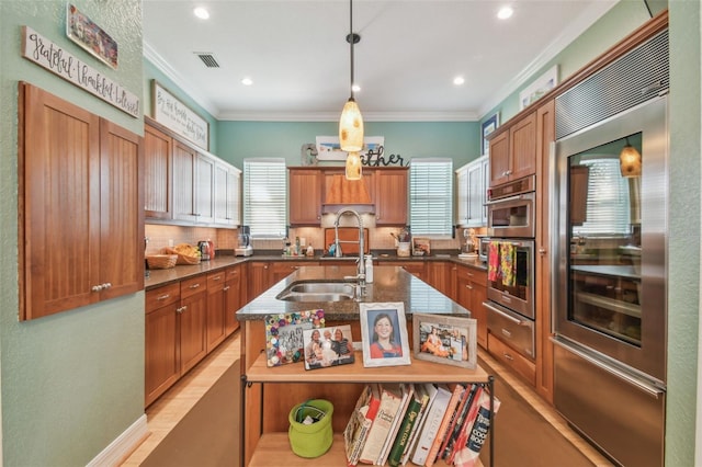 1326 Apollo Beach Blvd S, Apollo Beach, FL 33572 - kitchen with a sink, appliances with stainless steel finishes, crown molding, and a warming drawer