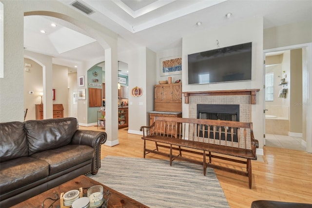 1326 Apollo Beach Blvd S, Apollo Beach, FL 33572 - living area featuring arched walkways, visible vents, and light wood-style flooring