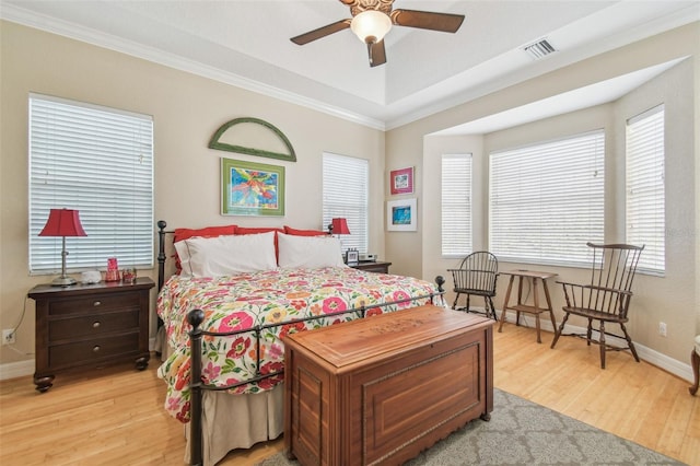 1326 Apollo Beach Blvd S, Apollo Beach, FL 33572 - bedroom with light wood-style floors, ornamental molding, baseboards, and multiple windows