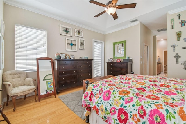 1326 Apollo Beach Blvd S, Apollo Beach, FL 33572 - bedroom with crown molding, visible vents, multiple windows, and light wood-type flooring