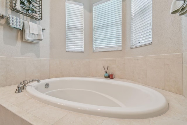 1326 Apollo Beach Blvd S, Apollo Beach, FL 33572 - bathroom with a textured wall and a bath
