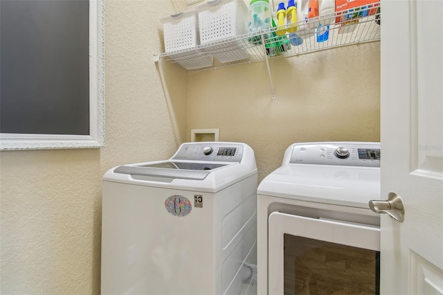 1326 Apollo Beach Blvd S, Apollo Beach, FL 33572 - laundry area with laundry area, a textured wall, and washing machine and dryer