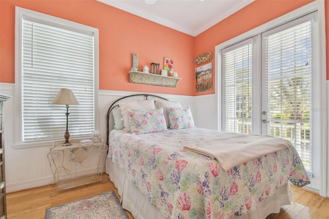 1326 Apollo Beach Blvd S, Apollo Beach, FL 33572 - bedroom with wainscoting, access to exterior, and wood finished floors
