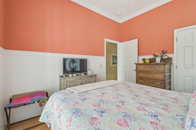 1326 Apollo Beach Blvd S, Apollo Beach, FL 33572 - bedroom featuring crown molding, a ceiling fan, and wainscoting