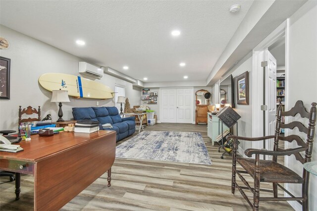 1326 Apollo Beach Blvd S, Apollo Beach, FL 33572 - living room featuring a wall unit AC, recessed lighting, and wood finished floors